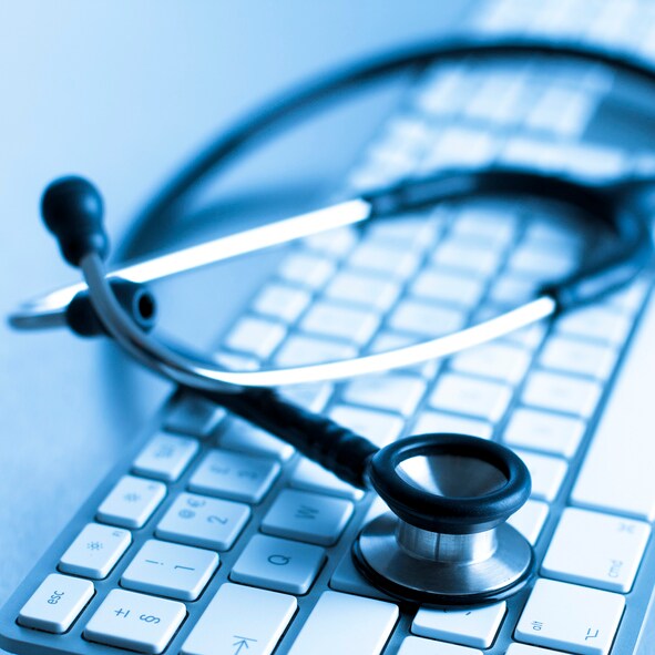Computer keyboard and stethoscope, conceptual image.