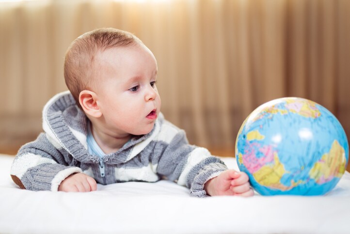 Baby with globe