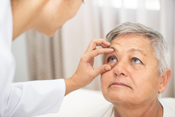 Doctor examining patient's eye.