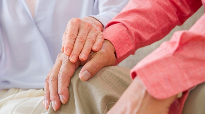 Elderly Japanese couple holding hands